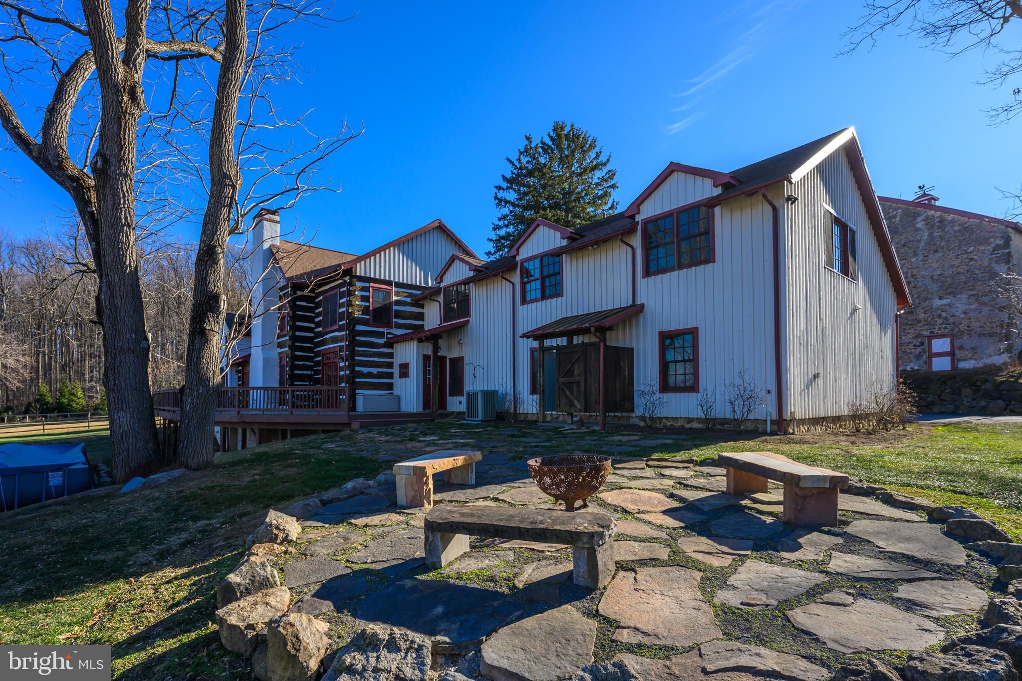 201 Pine Swamp Road Elverson, PA 19520 - Photo 44 of 60 a front view of a house with garden and patio