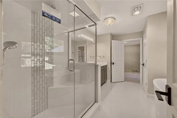a bathroom with a shower and a sink