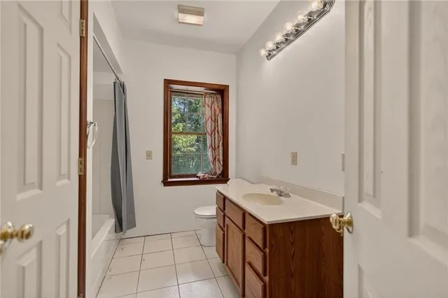 a bathroom with a sink vanity and a mirror