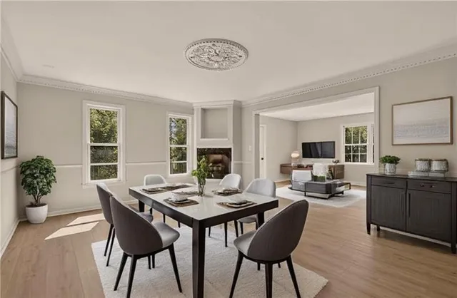 a view of a dining room with furniture window and wooden floor