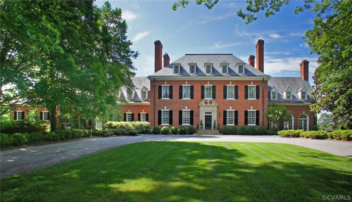 8899 River Road Henrico, VA 23229 - Photo 1 of 50 a front view of a house with a garden