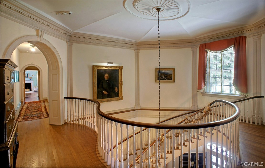 8899 River Road Henrico, VA 23229 - Photo 16 of 50 a view of a hallway with chandelier