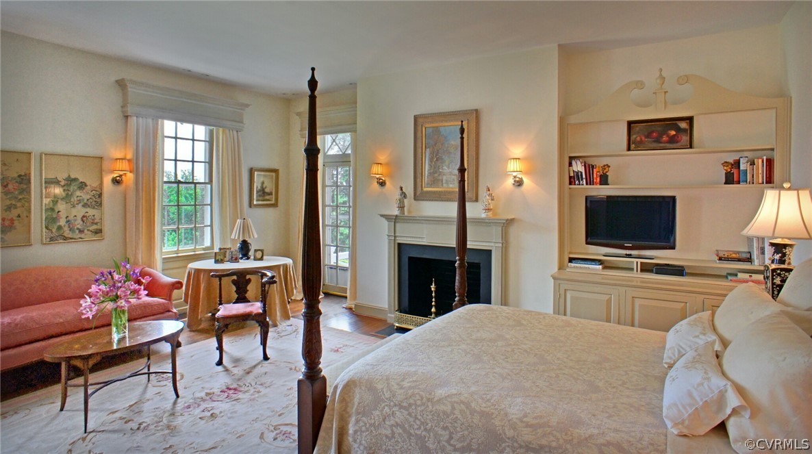 8899 River Road Henrico, VA 23229 - Photo 19 of 50 a bedroom with a bed and a flat screen tv