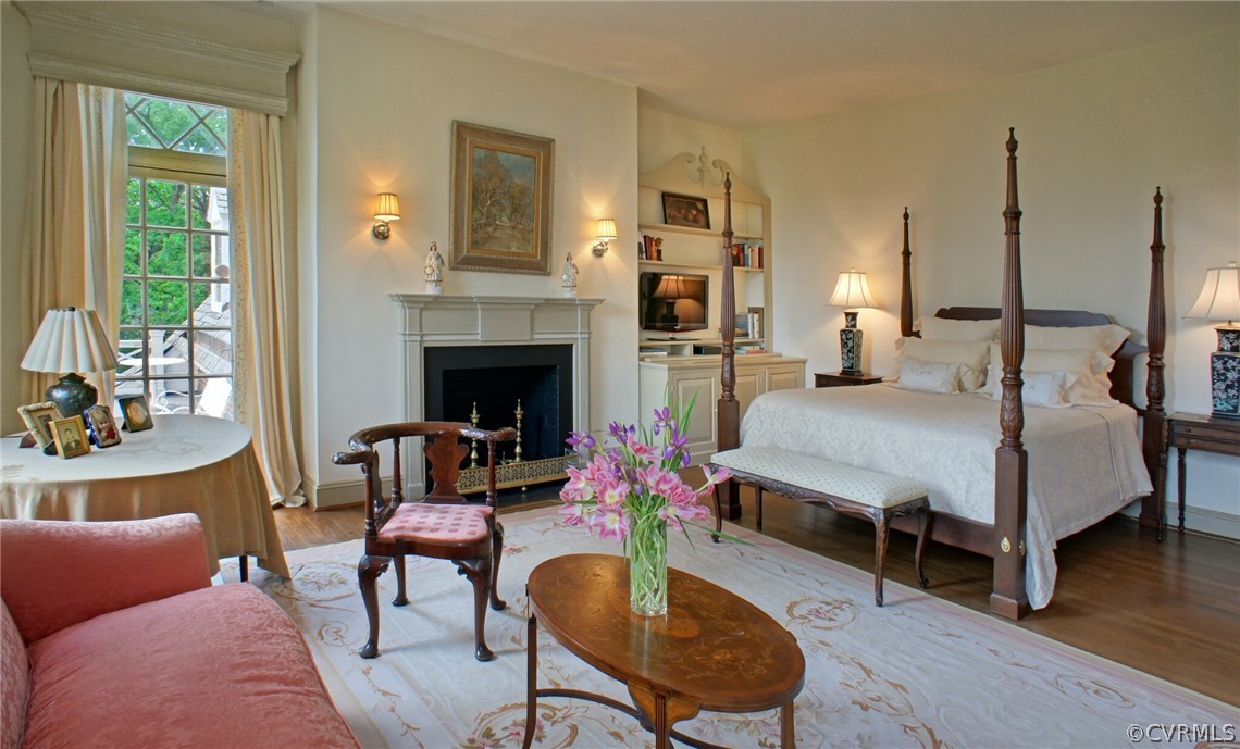 8899 River Road Henrico, VA 23229 - Photo 20 of 50 a bedroom with a bed a table and chair