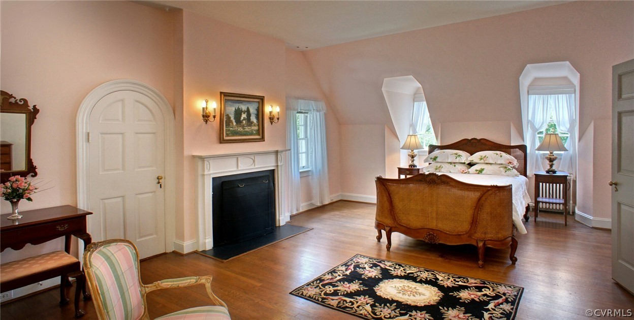 8899 River Road Henrico, VA 23229 - Photo 25 of 50 a living room with furniture fireplace and wooden floor
