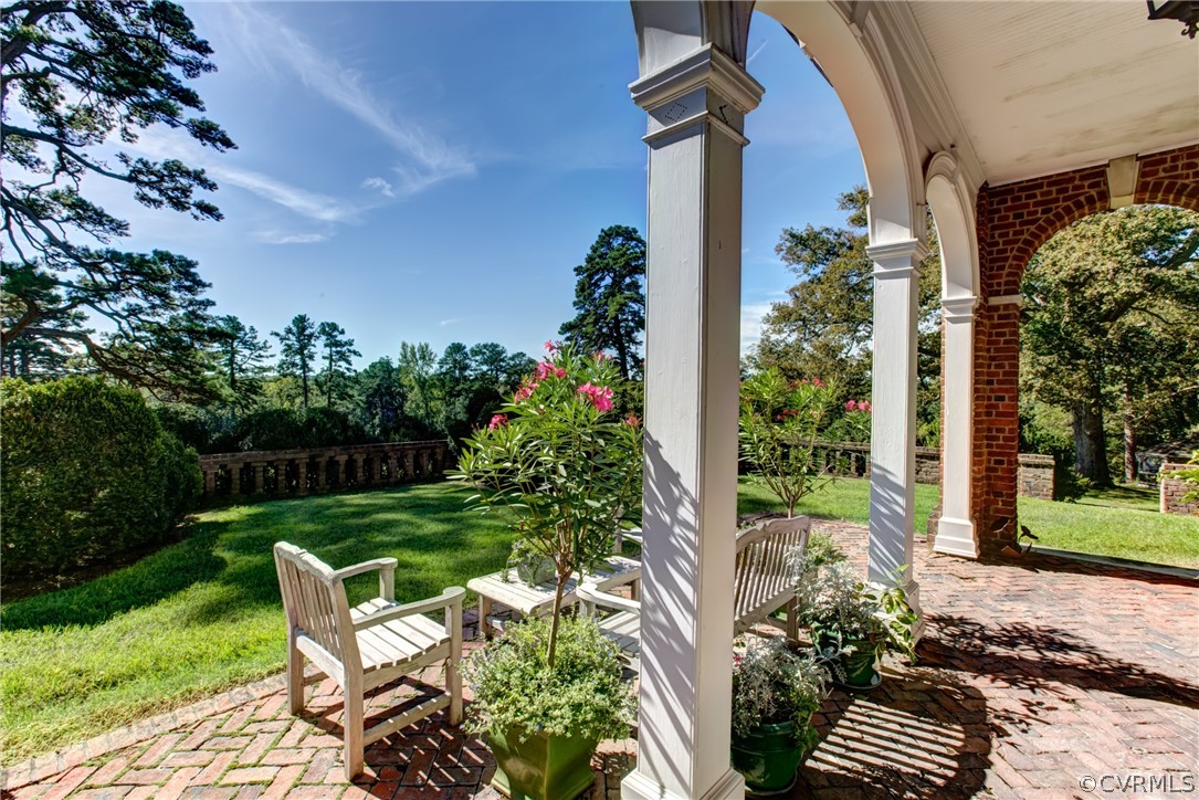 8899 River Road Henrico, VA 23229 - Photo 30 of 50 a view of a chair and table in backyard of the house