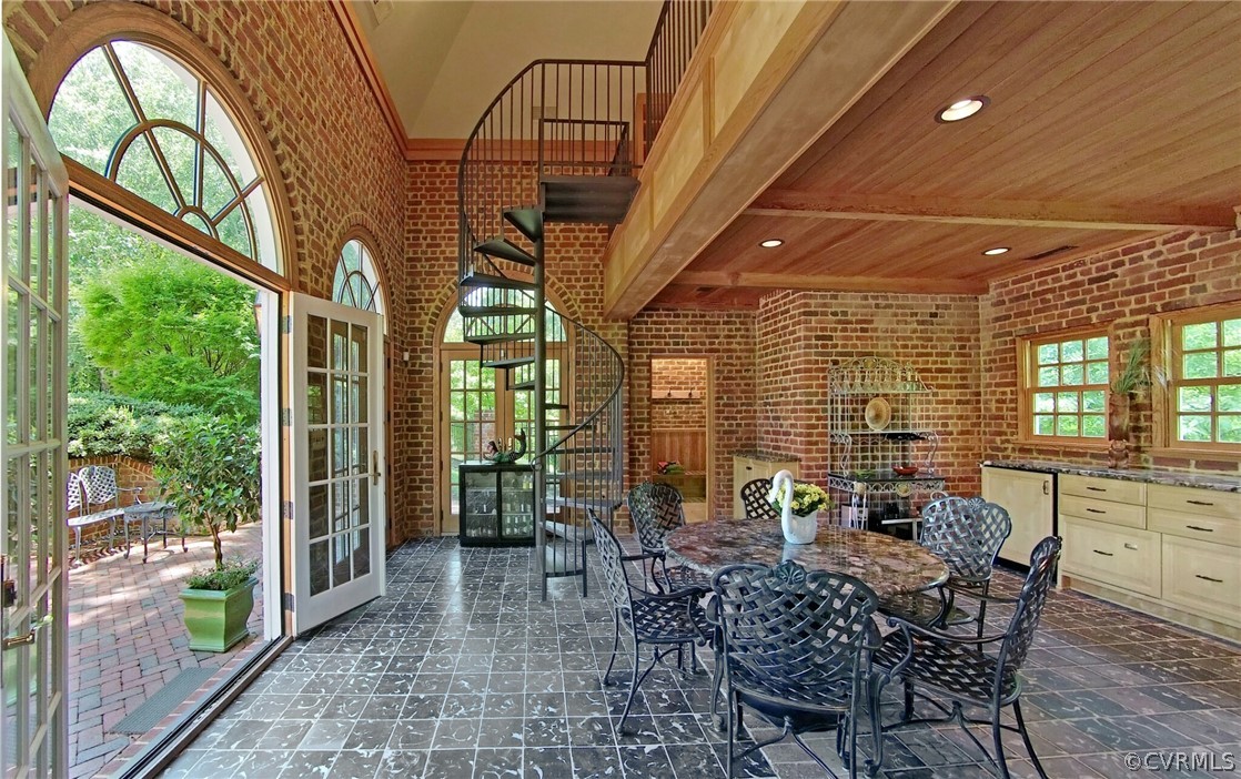 8899 River Road Henrico, VA 23229 - Photo 39 of 50 a view of a patio with table and chairs and potted plants