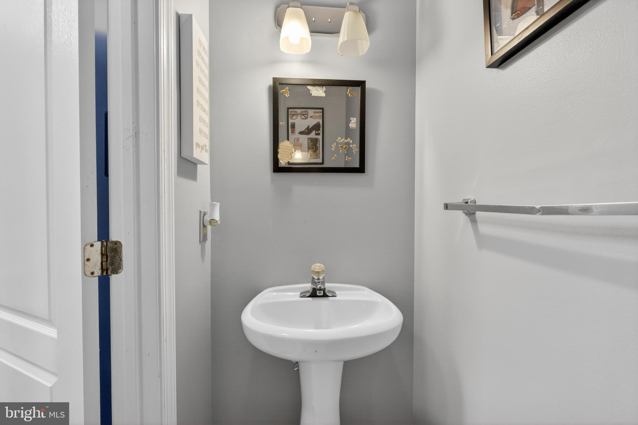 115 Bonnybrook Road Middletown, DE 19709 - Photo 22 of 31 a bathroom with a sink a mirror and a shower
