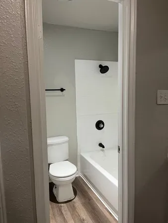 a bathroom with a sink a toilet and a bathtub