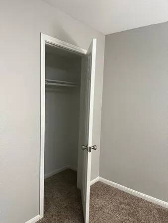 a kitchen with granite countertop a sink stove and cabinets