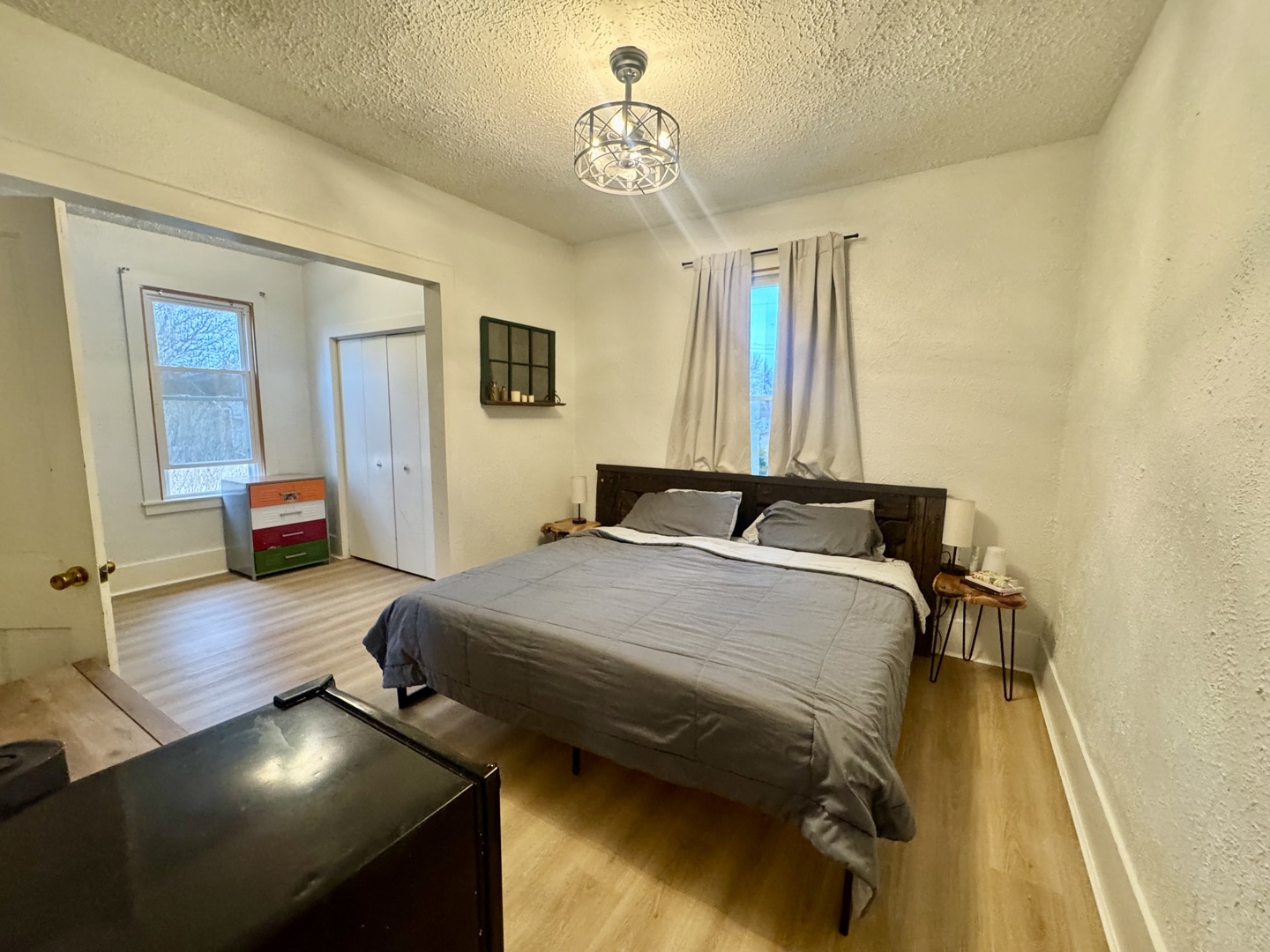 616 Northwest 2nd Avenue Aledo, IL 61231 - Photo 14 of 26 a bedroom with a bed and wooden floor