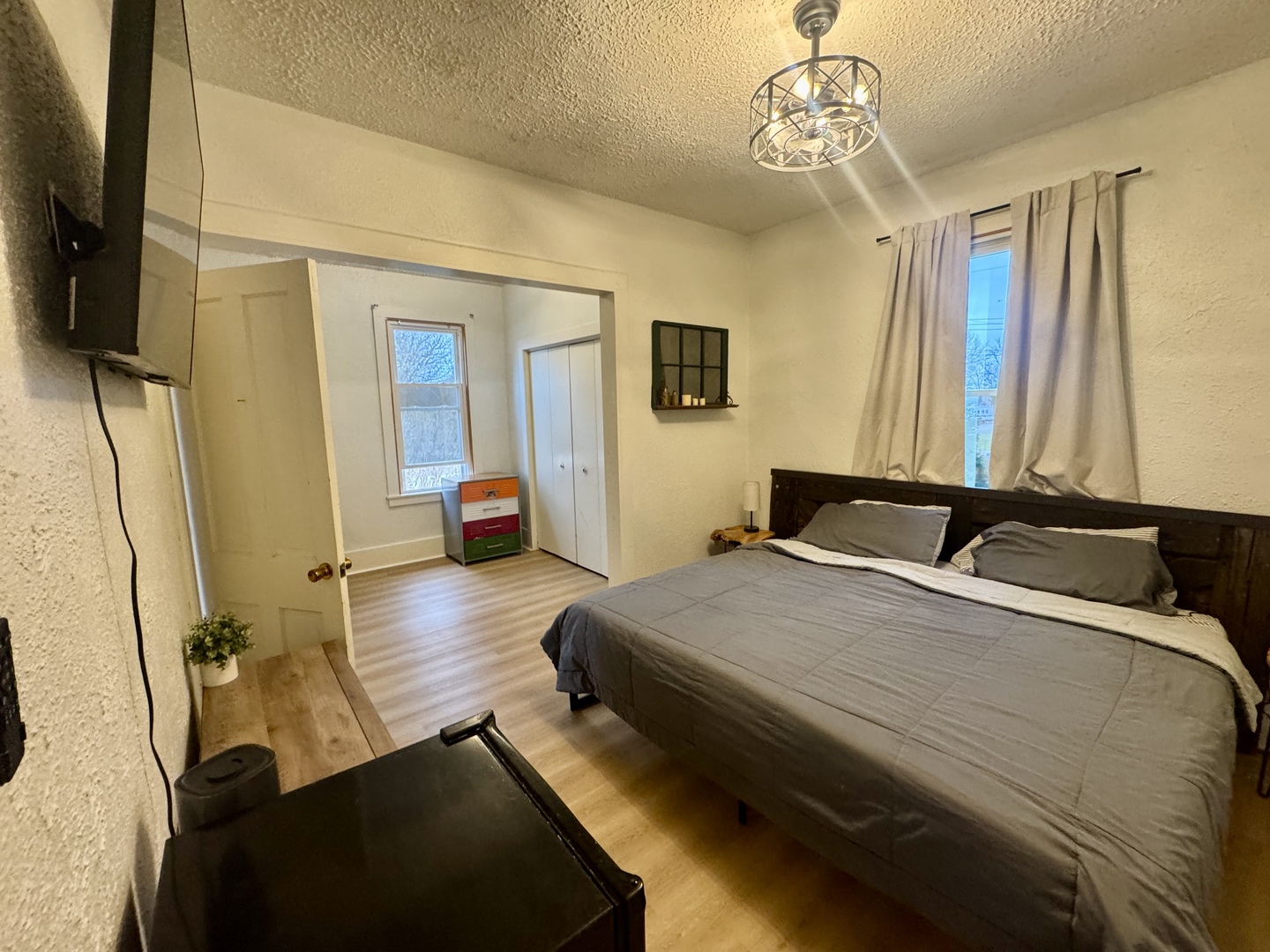 616 Northwest 2nd Avenue Aledo, IL 61231 - Photo 15 of 26 a bedroom with a bed and wooden floor