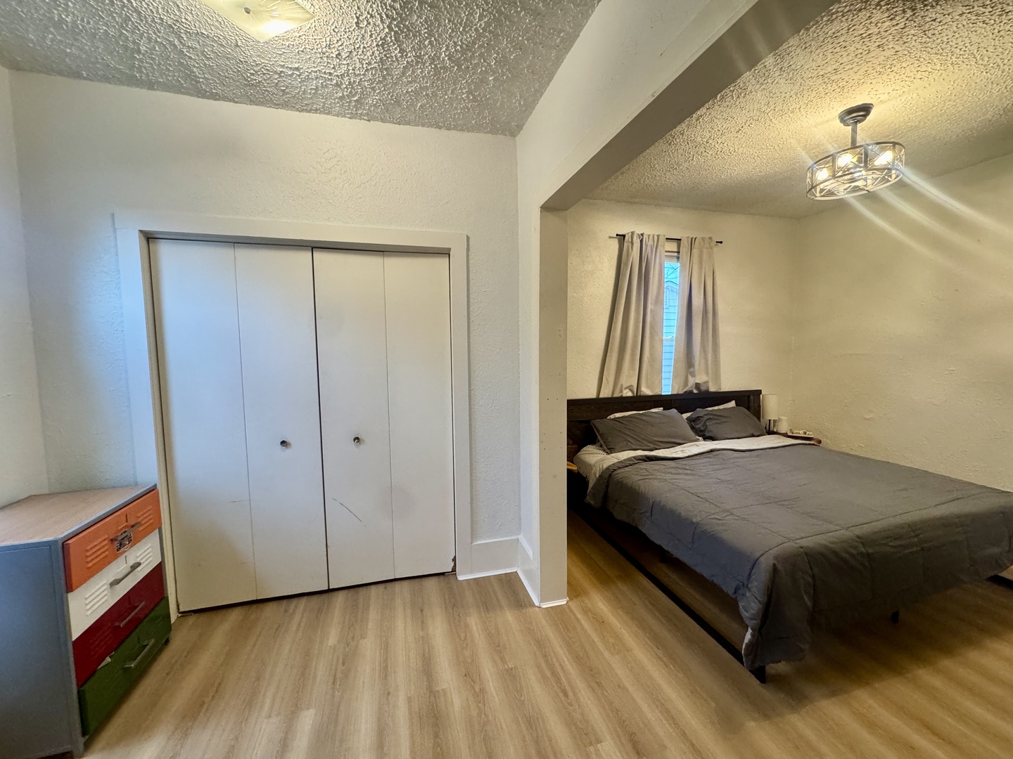 616 Northwest 2nd Avenue Aledo, IL 61231 - Photo 18 of 26 a bedroom with a bed and a mirror