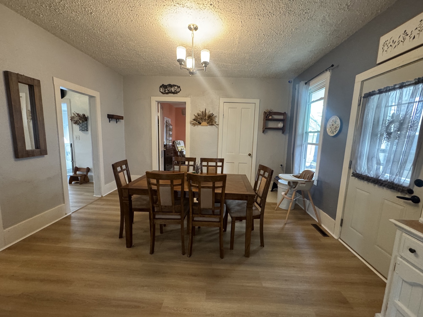 616 Northwest 2nd Avenue Aledo, IL 61231 - Photo 7 of 26 a view of a dining room with furniture window and wooden floor