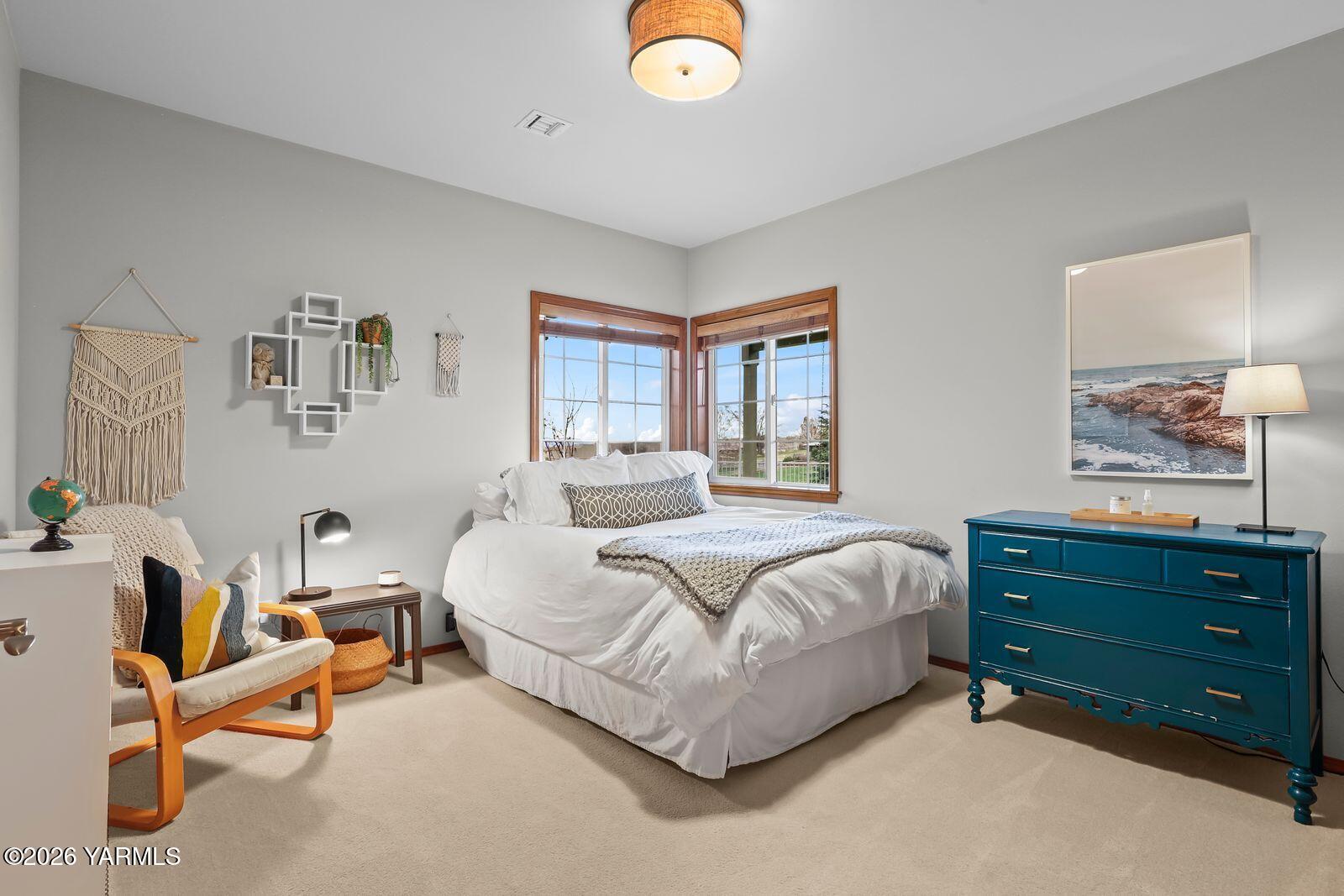 11105 Zier Road Yakima, WA 98908 - Photo 46 of 65 a spacious bedroom with a bed and window