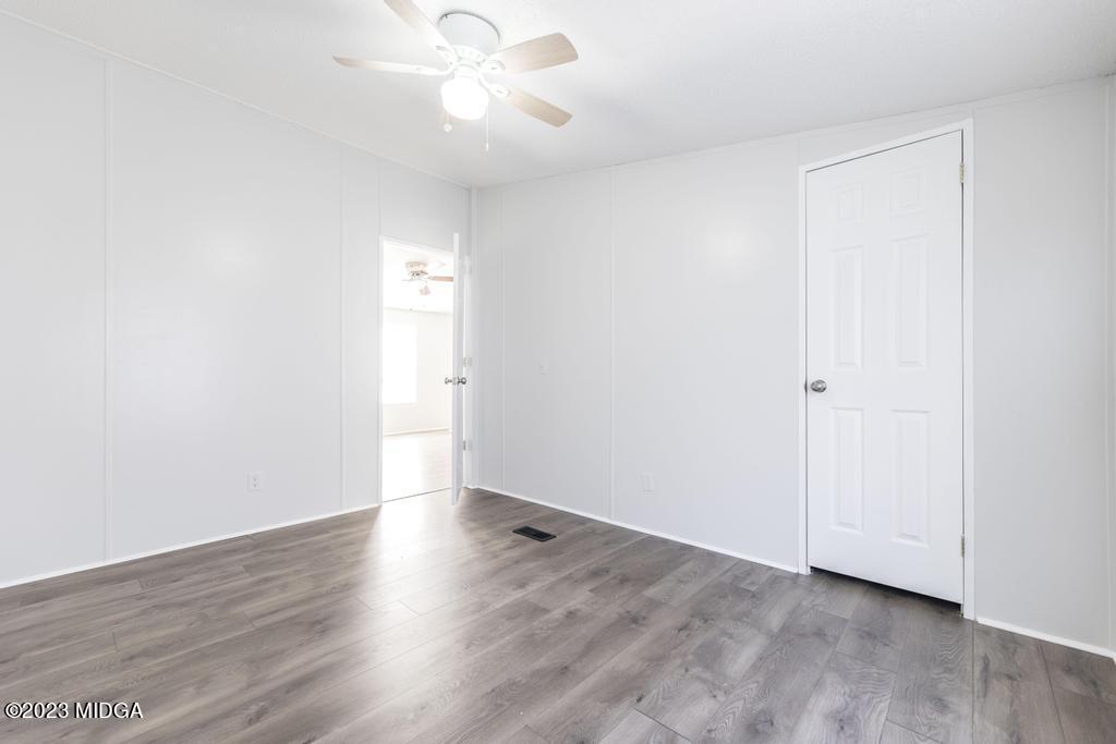 208 Colonial Drive Byron, GA 31008 - Photo 26 of 38 a view of an empty room with wooden floor