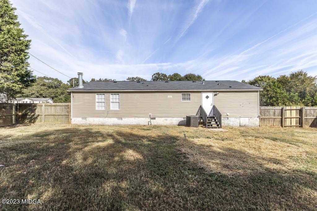 208 Colonial Drive Byron, GA 31008 - Photo 36 of 38 a view of a lake from a yard