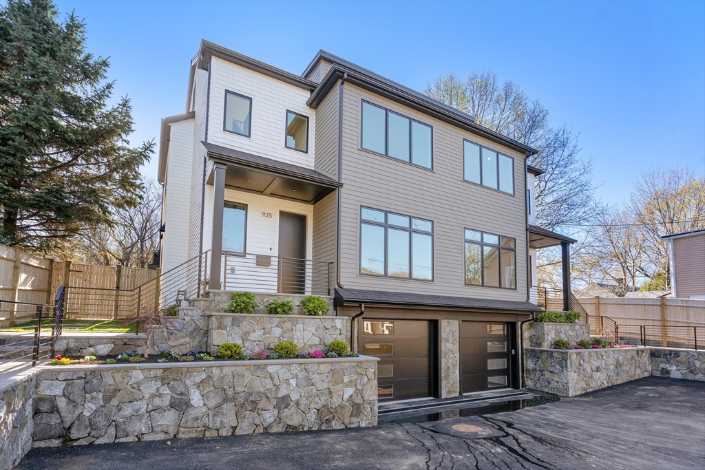 935 Walnut Street, Unit 935 Newton, MA 02461 - Photo 1 of 39 a front view of a house with a yard