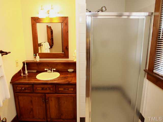6600 Ten-Ten Road Apex, NC 27539 - Photo 14 of 25 Master Bathroom with ceramic shower and wood vanity. Other