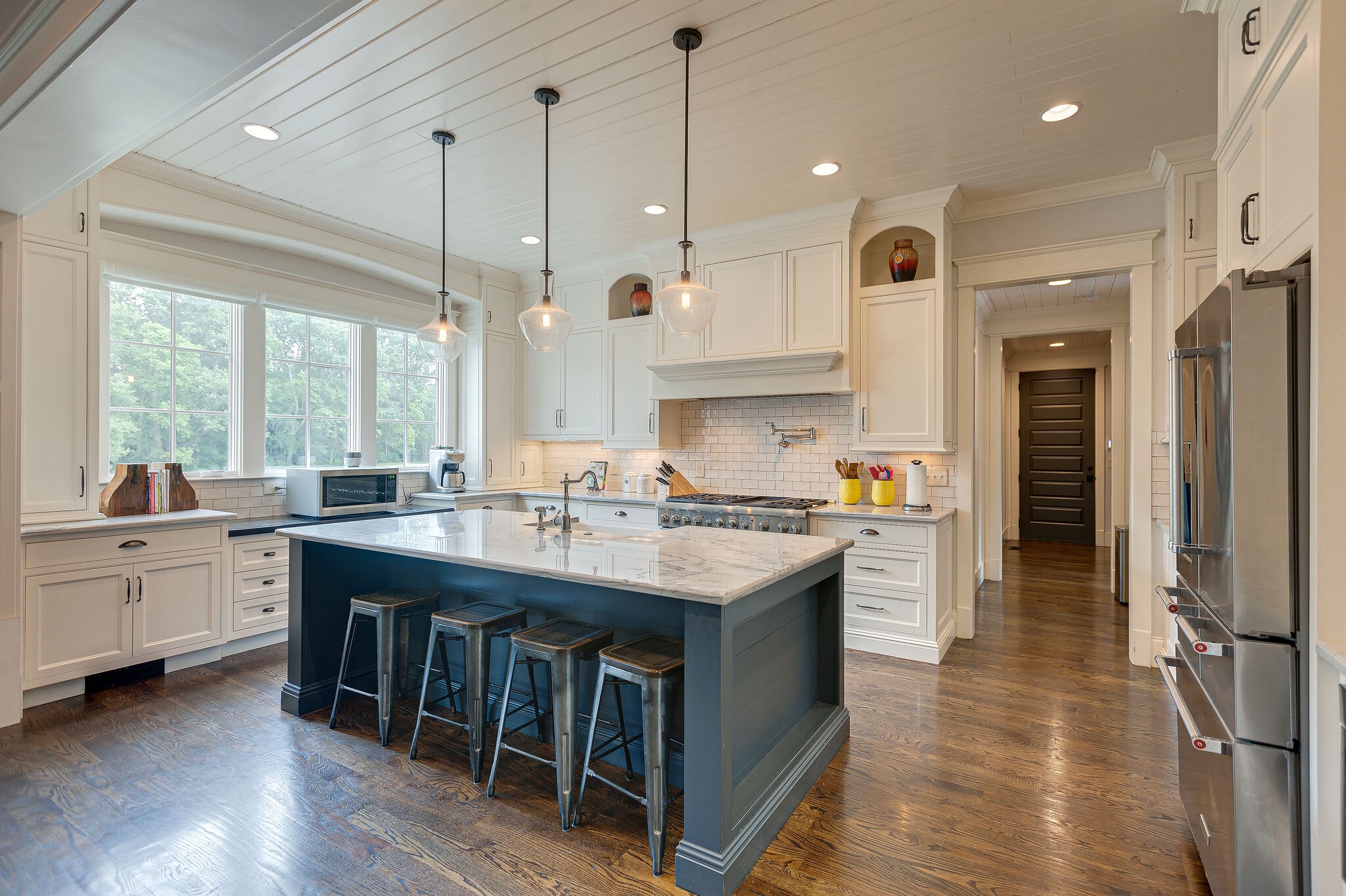 4114 Trinity Road College Grove, TN 37046 - Photo 15 of 49 a kitchen with kitchen island granite countertop a sink appliances and cabinets