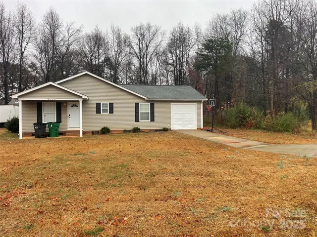a house with trees in the background