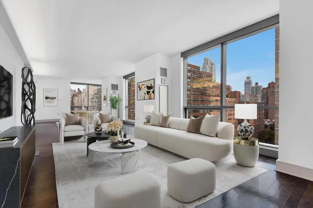 a living room with furniture or couch and a large window