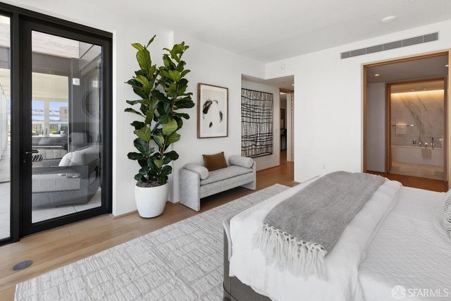 a view of a living room with racks on the wall and a window