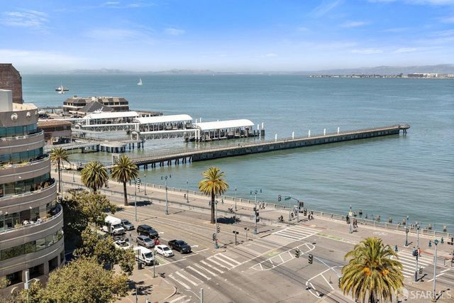 a living room with furniture and next to a window