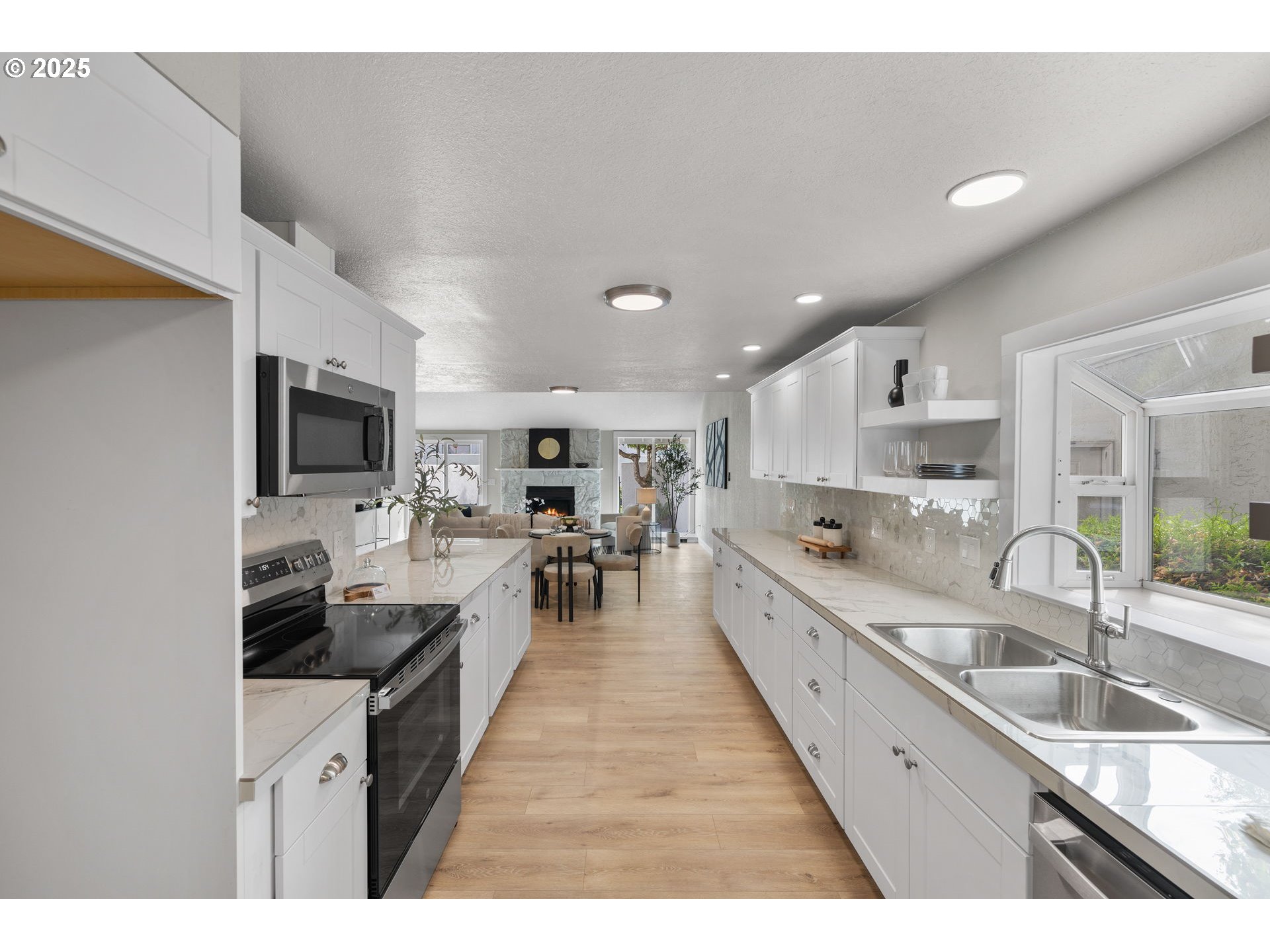 3240 Northeast 29th Street Gresham, OR 97030 - Photo 12 of 29 a large kitchen with stainless steel appliances lots of counter space and a sink