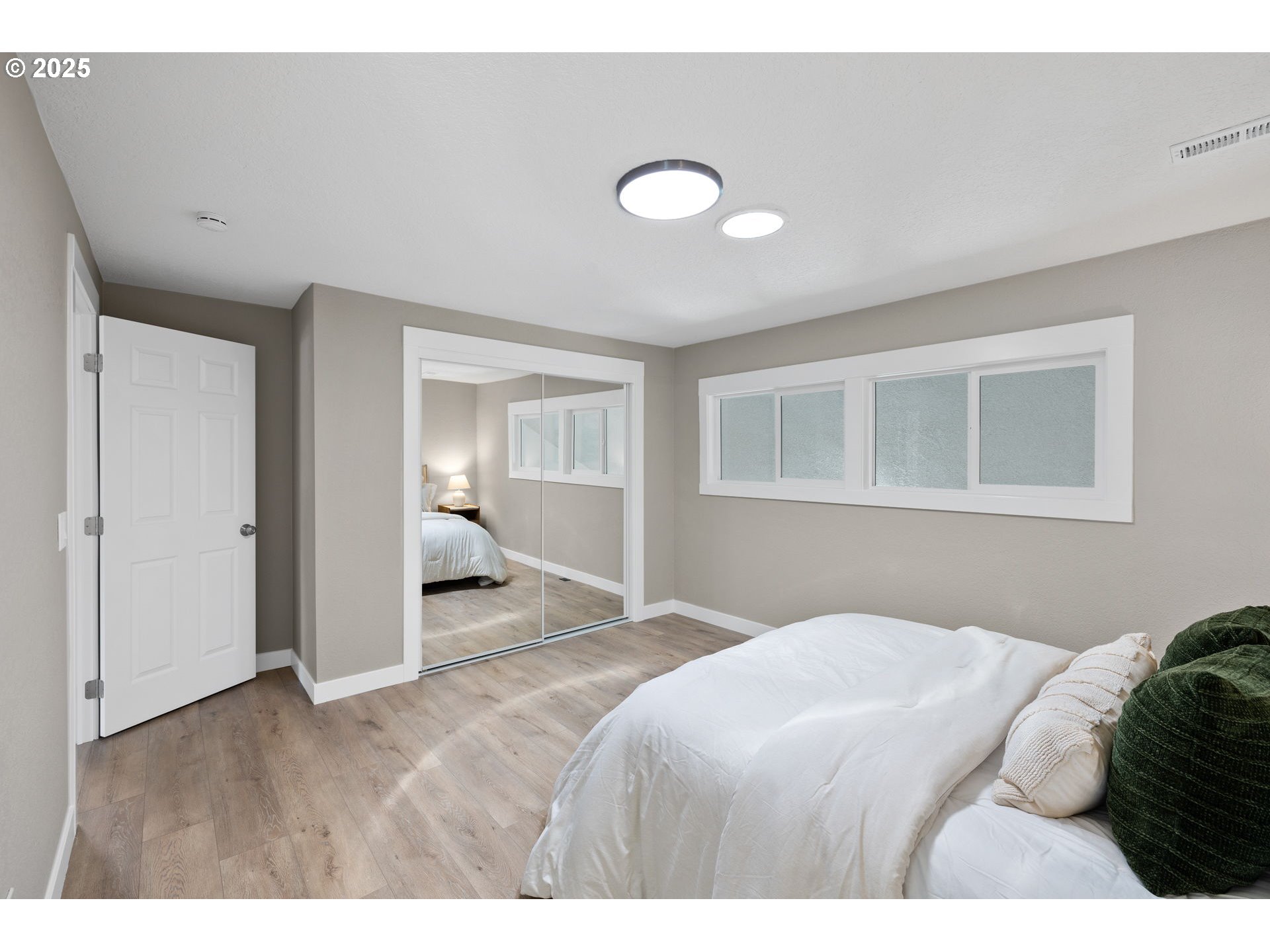 3240 Northeast 29th Street Gresham, OR 97030 - Photo 17 of 29 a bedroom with a large bed and a window