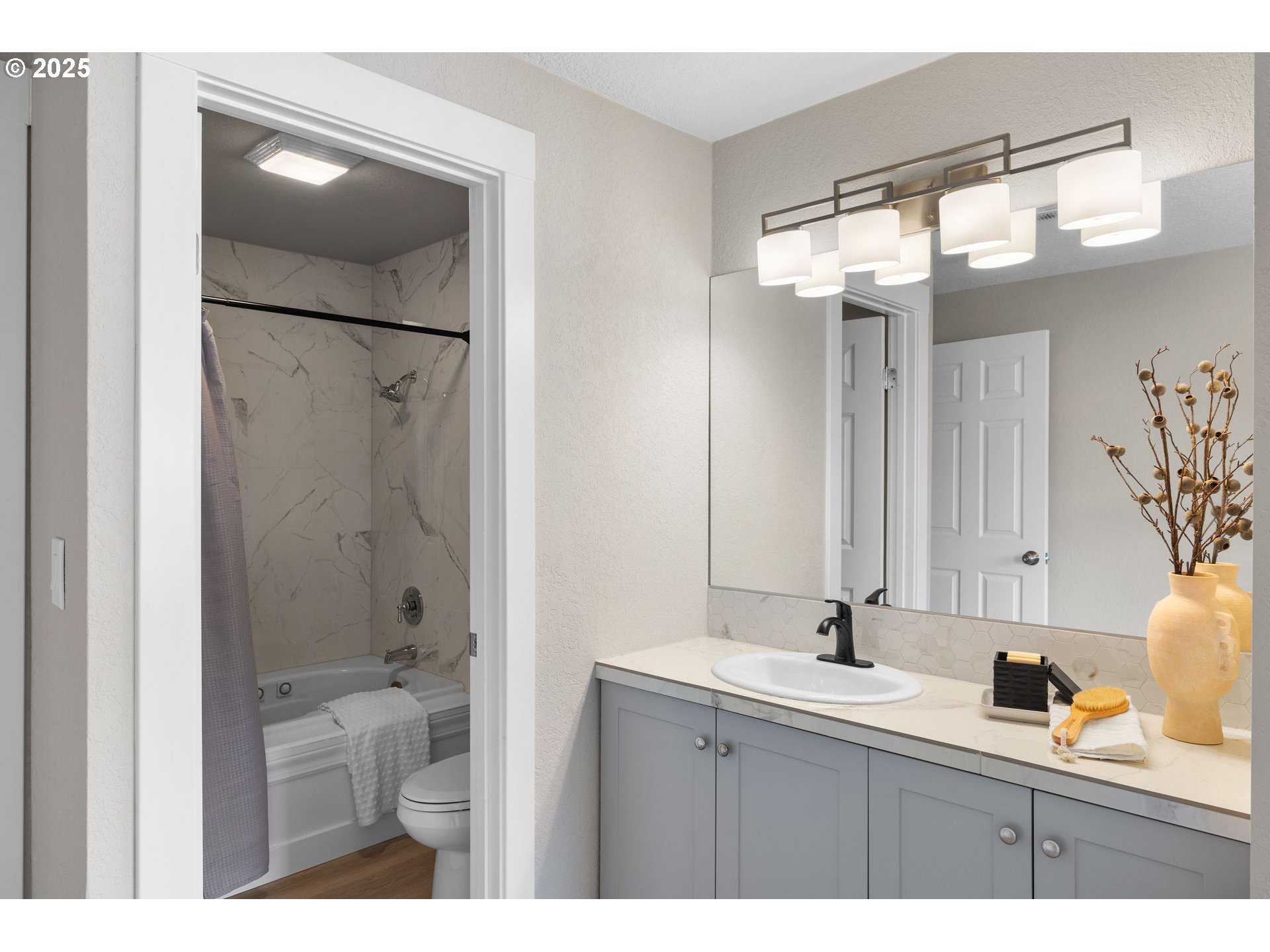 3240 Northeast 29th Street Gresham, OR 97030 - Photo 21 of 29 a bathroom with a sink mirror and a shower