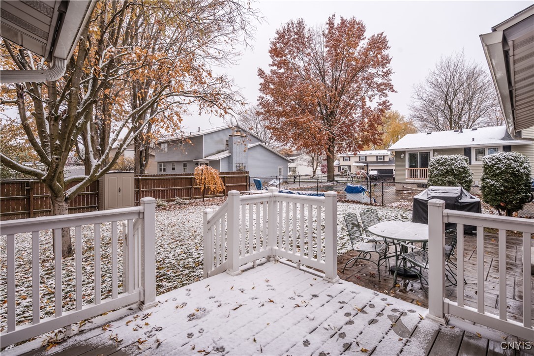 4976 Surrey Lane Clay, NY 13088 - Photo 14 of 47 New composite deck leads to new stampcrete patio w