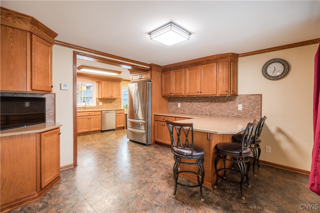 4976 Surrey Lane Clay, NY 13088 - Photo 25 of 47 Nice sitting peninsula offers flexible gathering s