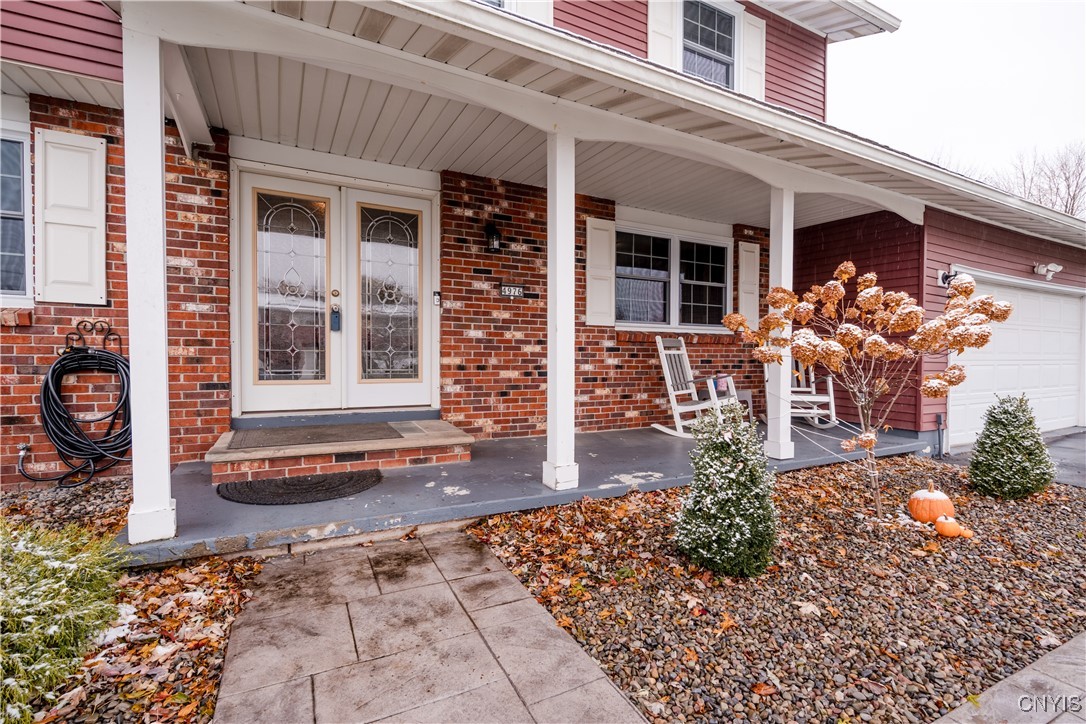 4976 Surrey Lane Clay, NY 13088 - Photo 5 of 47 Covered front porch and new stampcrete walkway.