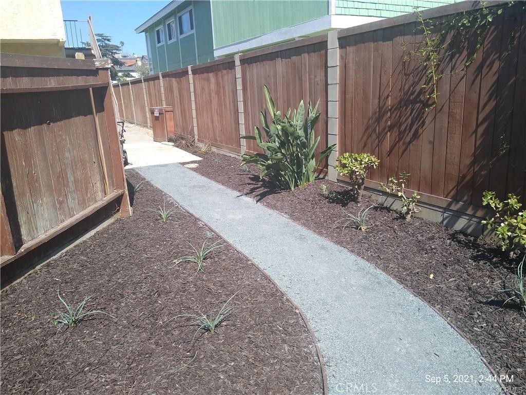 34591 Via Verde, Unit A Dana Point, CA 92624 - Photo 13 of 13 a backyard of a house with plants