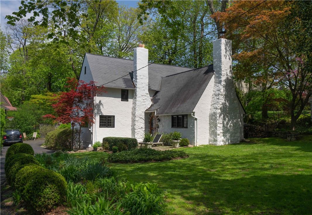 a front view of house with yard and green space