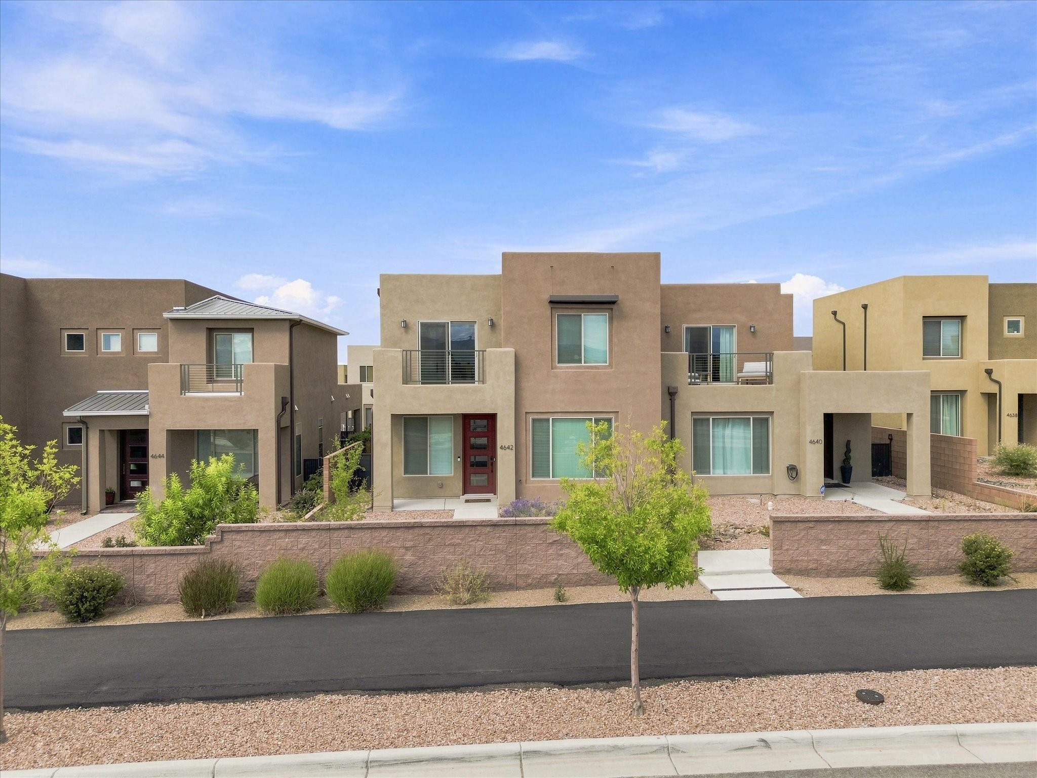 4642 Rail Runner Road Santa Fe, NM 87507 - Photo 53 of 74 The spacious front exterior reflects the home's modern construction and thoughtful design.