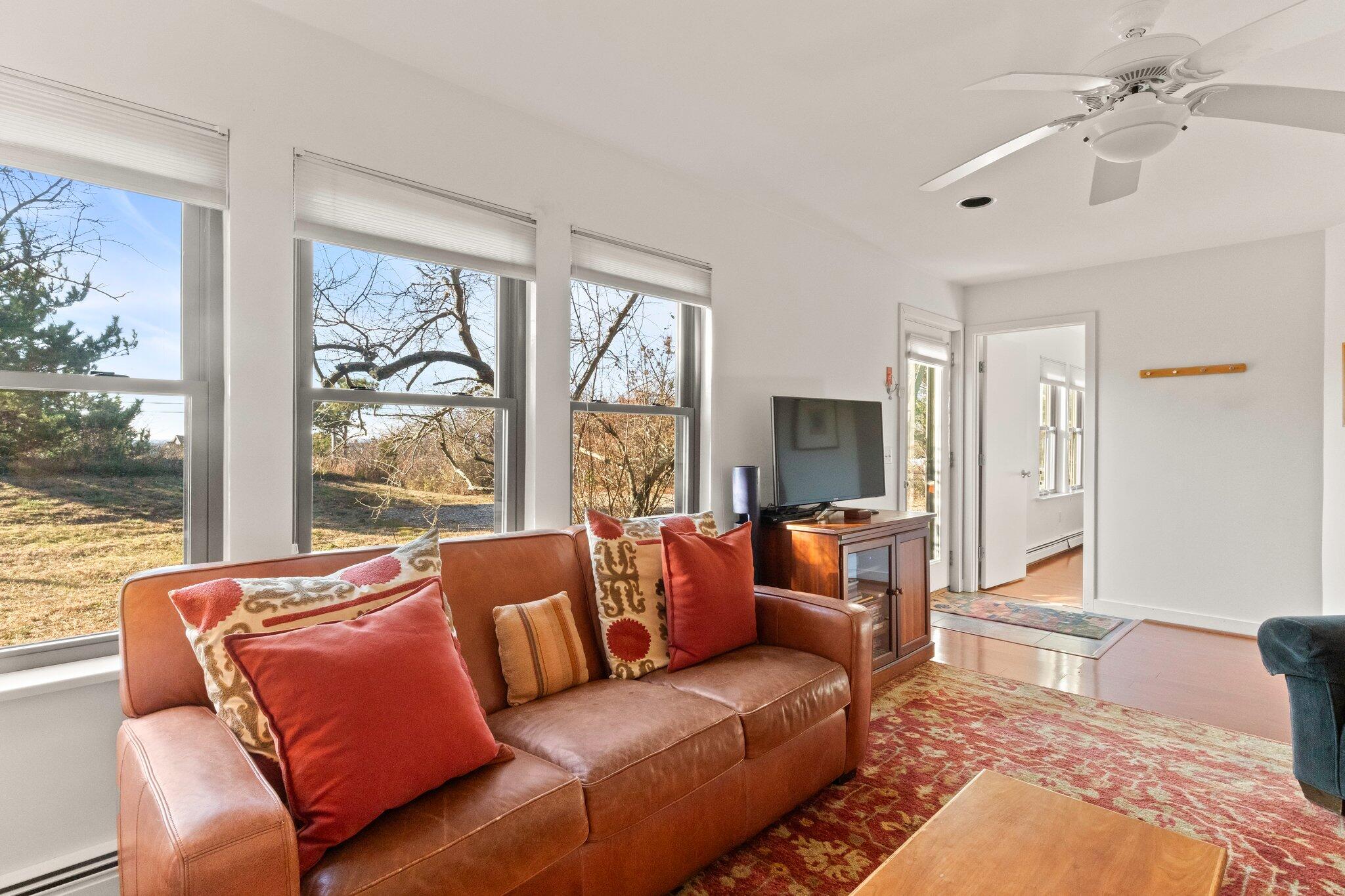 18 Bay View Road Truro, MA 02666 - Photo 15 of 30 a living room with furniture and a large window