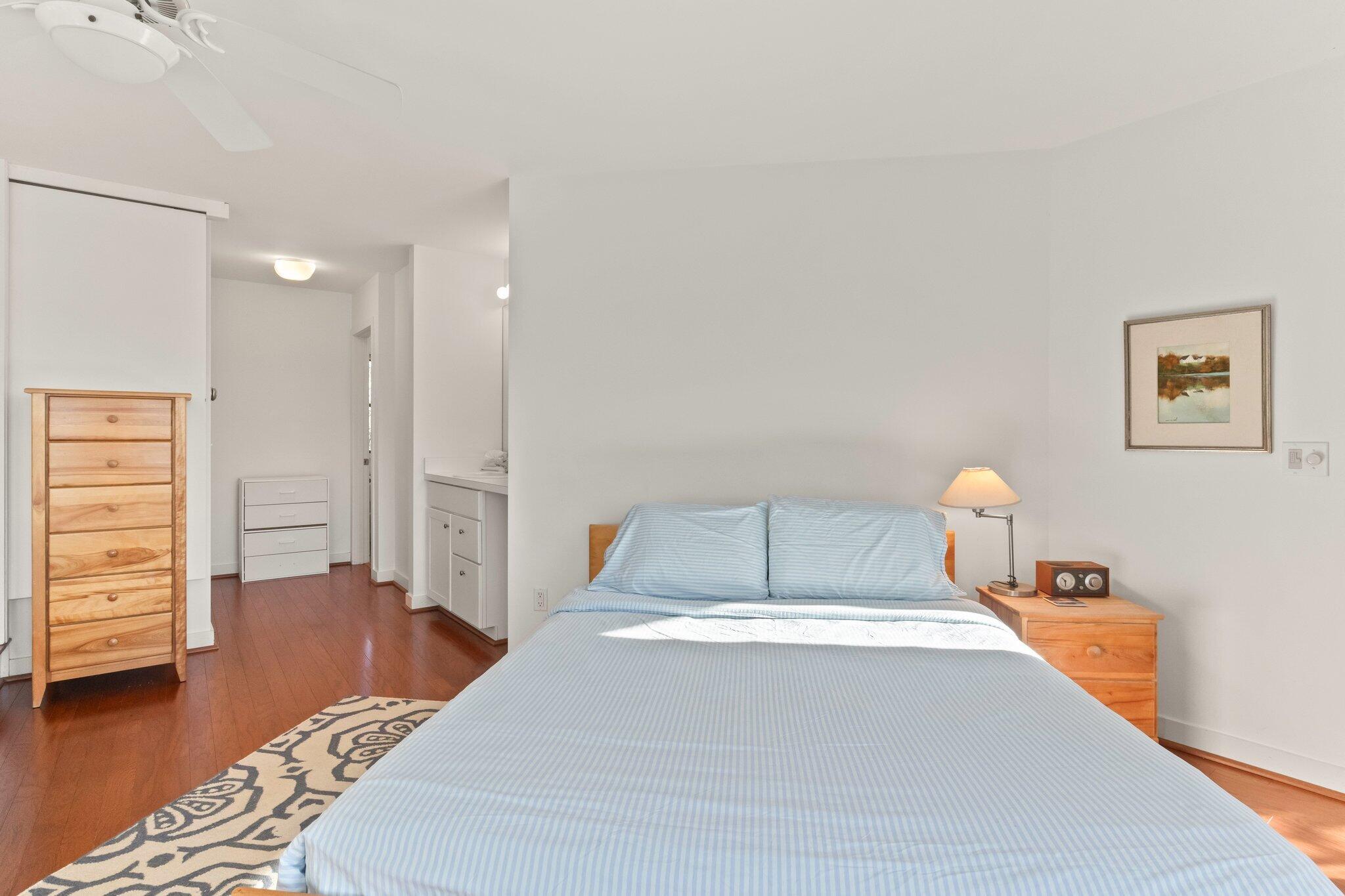 18 Bay View Road Truro, MA 02666 - Photo 18 of 30 a spacious bedroom with a bed and closet