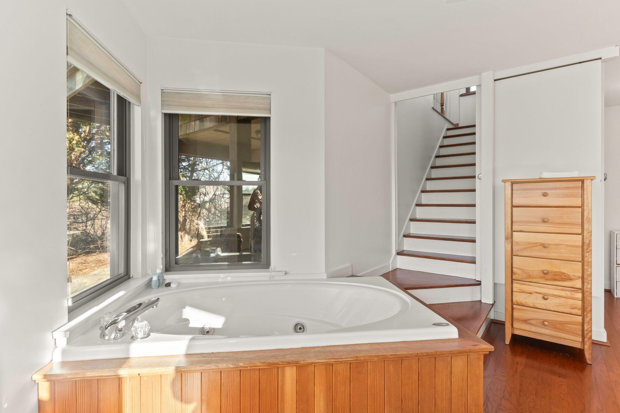18 Bay View Road Truro, MA 02666 - Photo 20 of 30 a bath tub sitting in a bathroom next to a window
