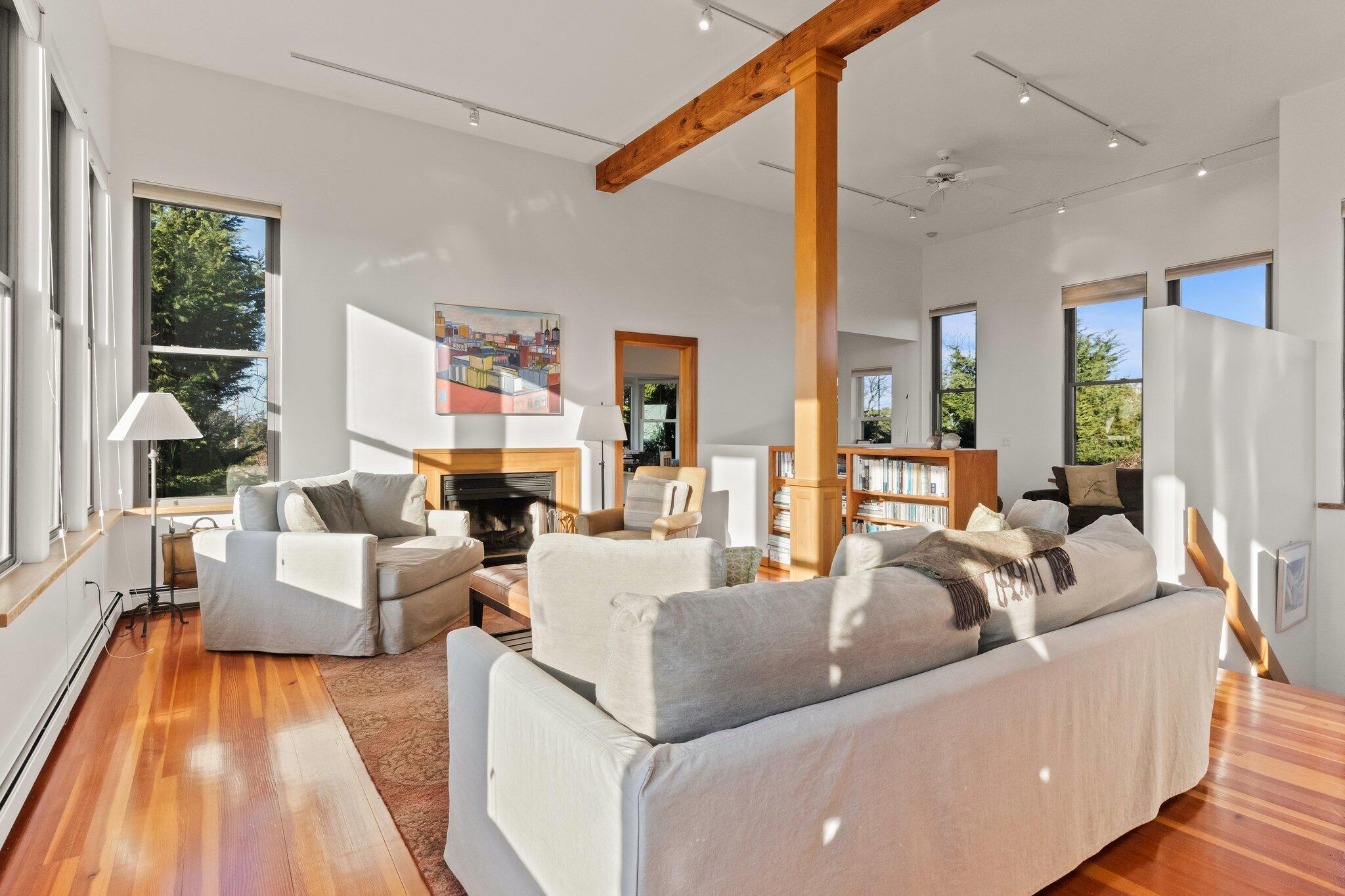18 Bay View Road Truro, MA 02666 - Photo 4 of 30 a living room with fireplace furniture and a large window