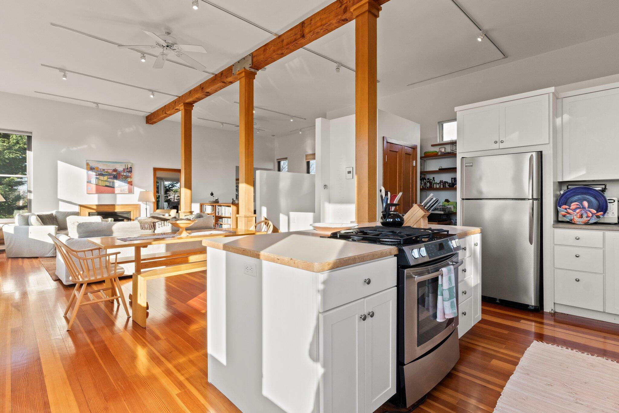 18 Bay View Road Truro, MA 02666 - Photo 7 of 30 a kitchen with stainless steel appliances granite countertop a stove a refrigerator a kitchen island a island a stove and a refrigerator