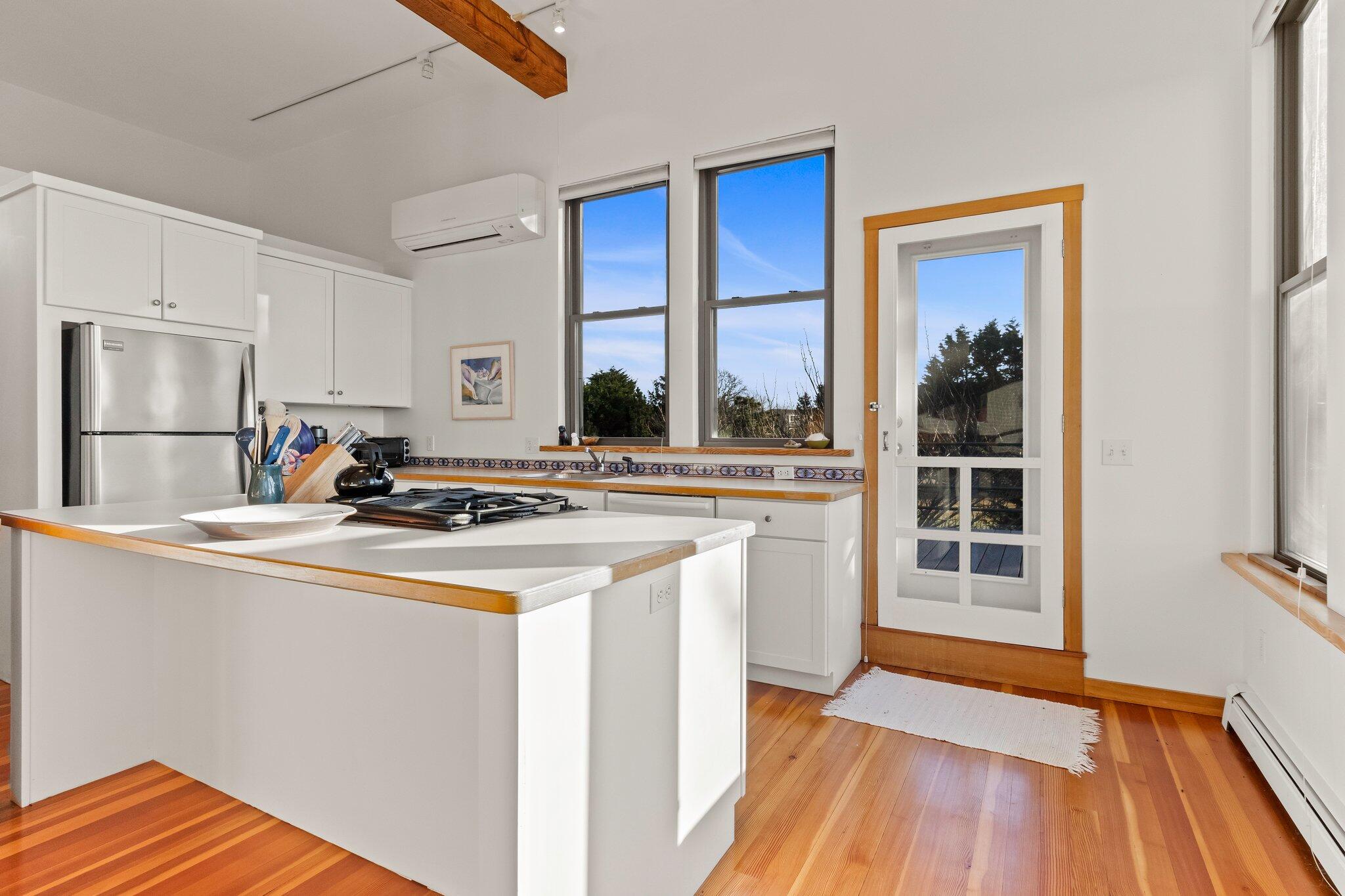 18 Bay View Road Truro, MA 02666 - Photo 8 of 30 a kitchen with stainless steel appliances granite countertop a stove and a sink
