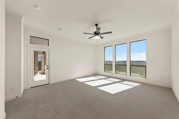 a view of an empty room with a window