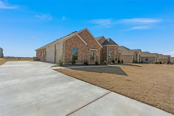 a view of large house with a yard