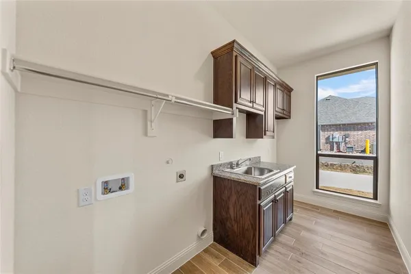 a kitchen with stainless steel appliances granite countertop a stove and a refrigerator