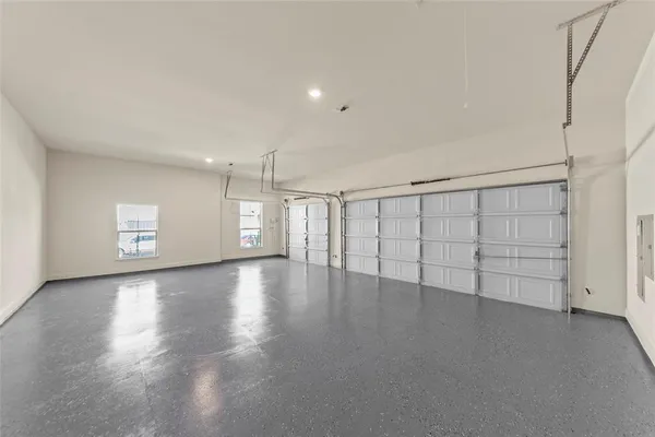 a kitchen with a refrigerator and a stove top oven