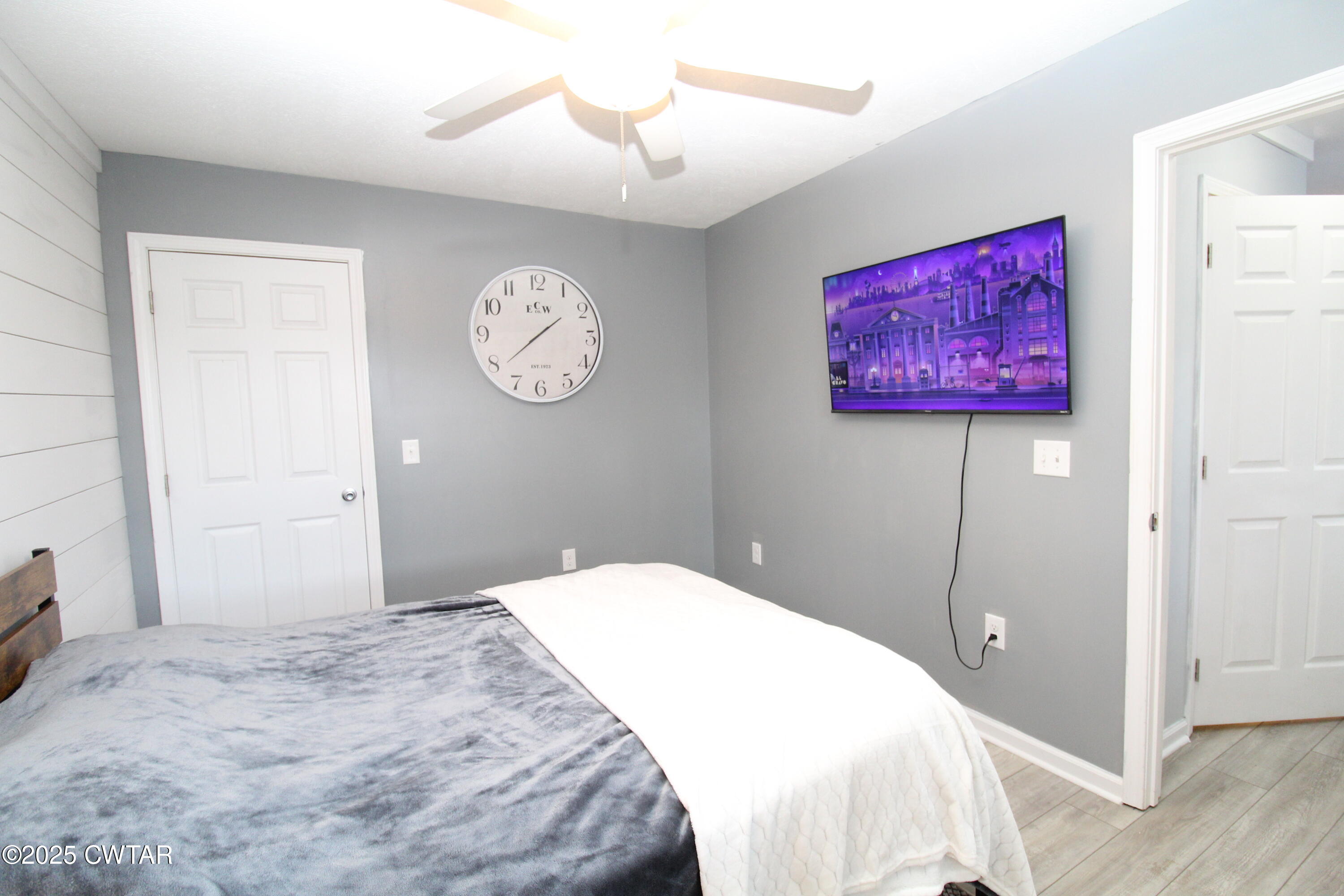 3125 Old Huntingdon Road Lexington, TN 38351 - Photo 12 of 17 a bedroom with a bed and a chandelier
