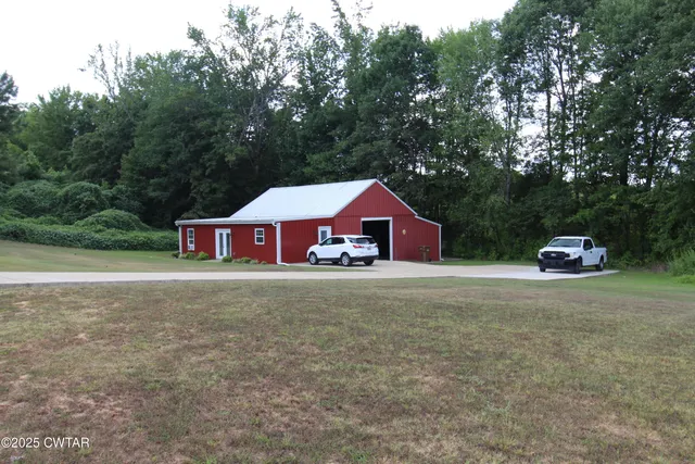 a front view of a house with yard