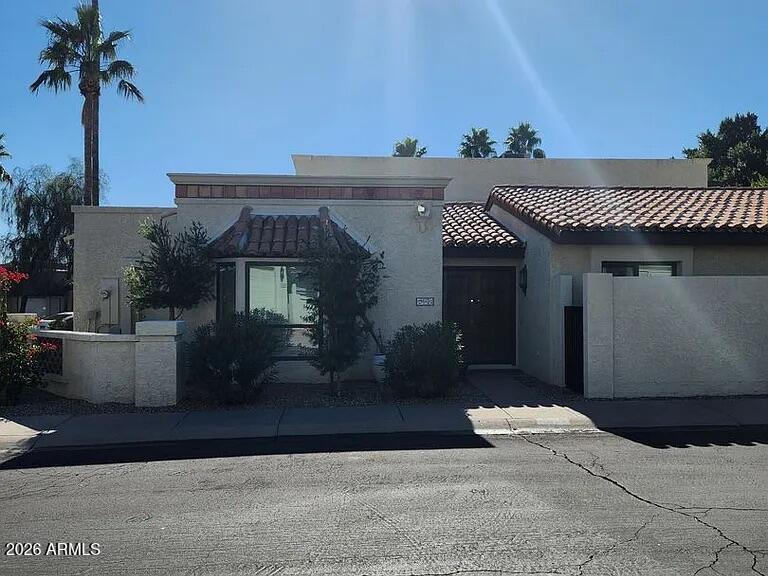 4615 East Monte Way Phoenix, AZ 85044 - Photo 3 of 18 a front view of a house with a yard